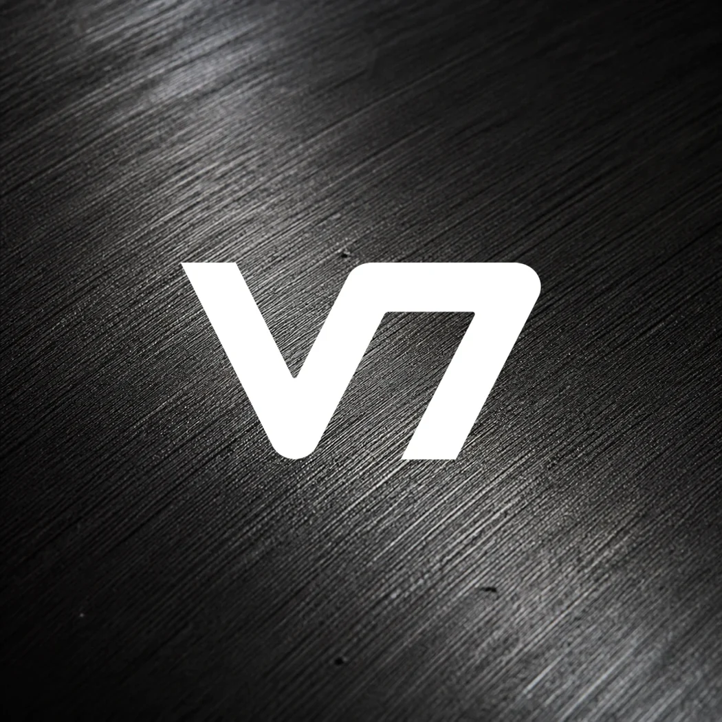 White V7 logo over a black graphite macro texture.