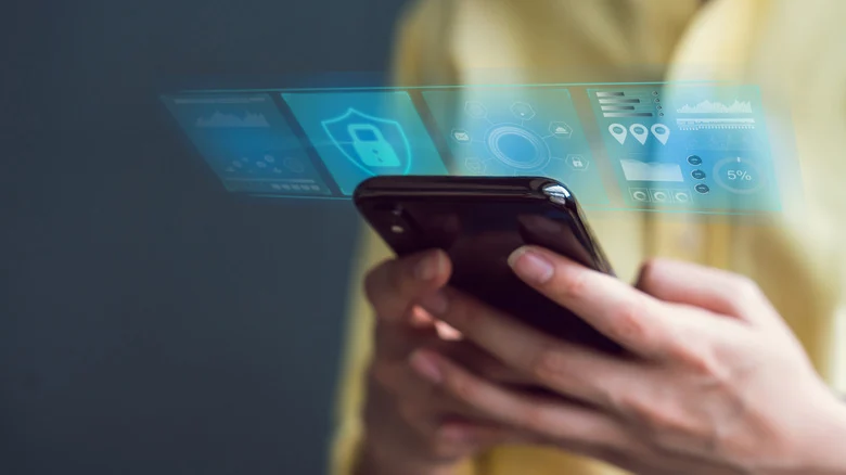 Person using smartphone with an overlay of security screens.