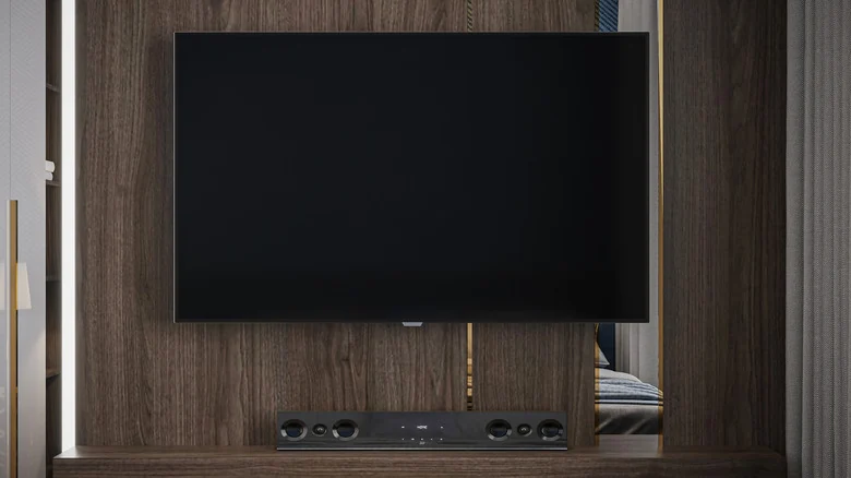 A modern living room with a TV and soundbar.